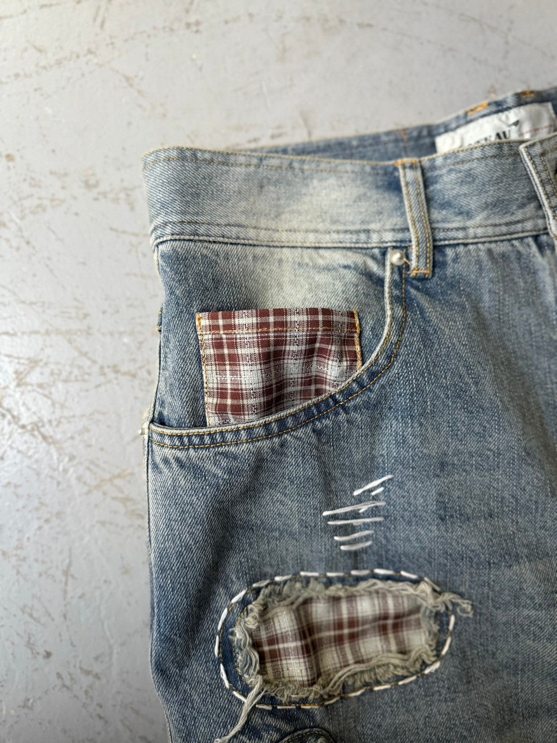 Patch denim pants